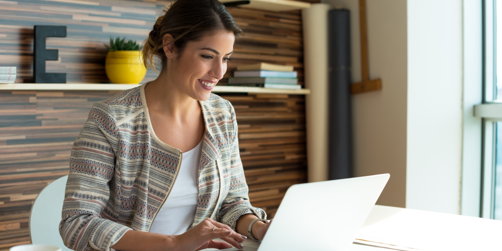 How to modernise your business Woman on laptop